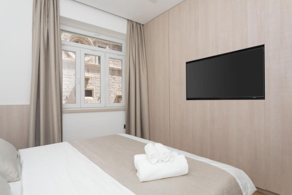 Televízia a/alebo spoločenská miestnosť v ubytovaní Étoile apartment