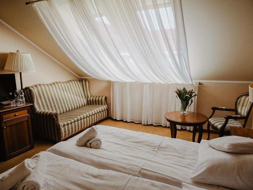 Postel nebo postele na pokoji v ubytování Hotel Delfin Spa&wellness