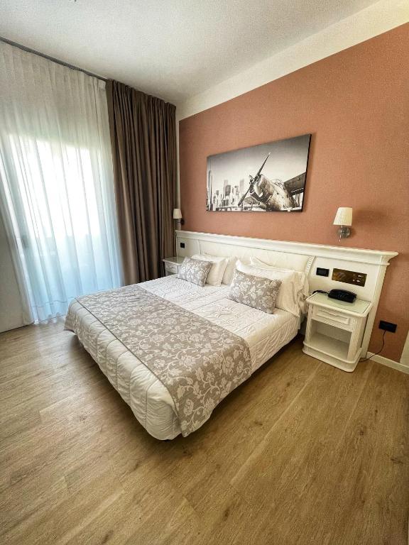 Postel nebo postele na pokoji v ubytování Park Hotel Cellini