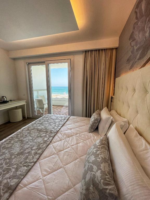 Postel nebo postele na pokoji v ubytování Park Hotel Cellini