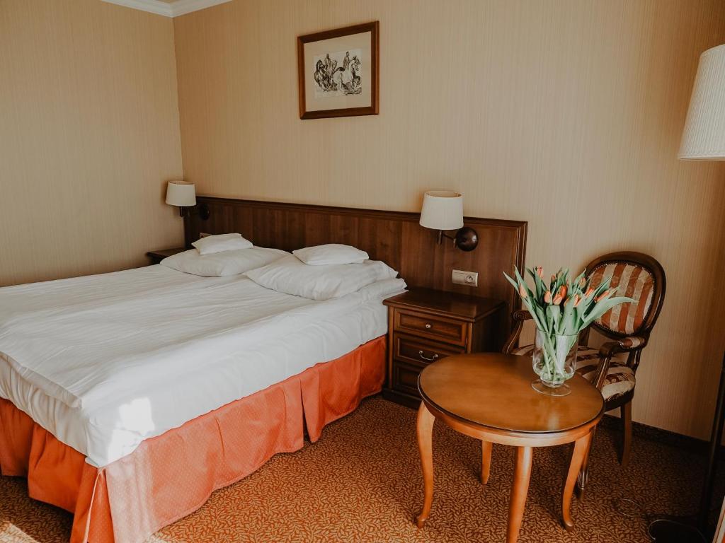 Postel nebo postele na pokoji v ubytování Hotel Delfin Spa&wellness
