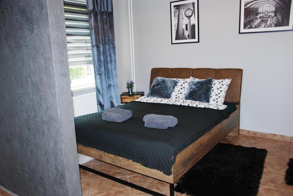 Postel nebo postele na pokoji v ubytování Kryjówka Męża