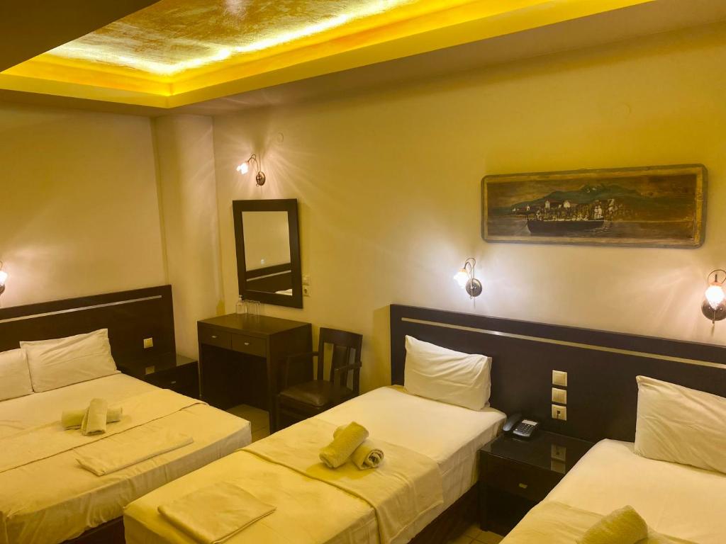 Postel nebo postele na pokoji v ubytování Hotel Alkionis