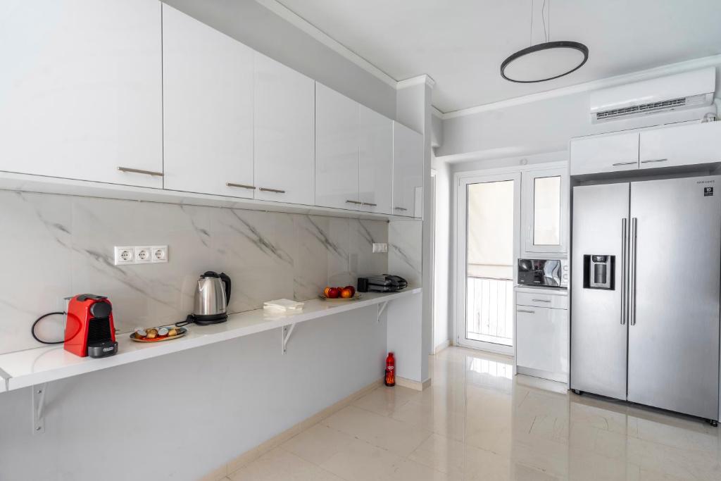 A kitchen or kitchenette at Penthouse in the heart of Athens / Koukaki area