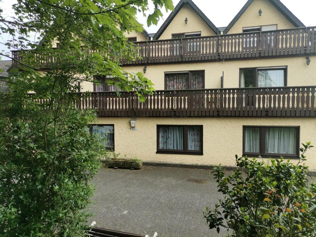 a large house with a balcony on top of it at Hotel Eulenhof in Gransdorf