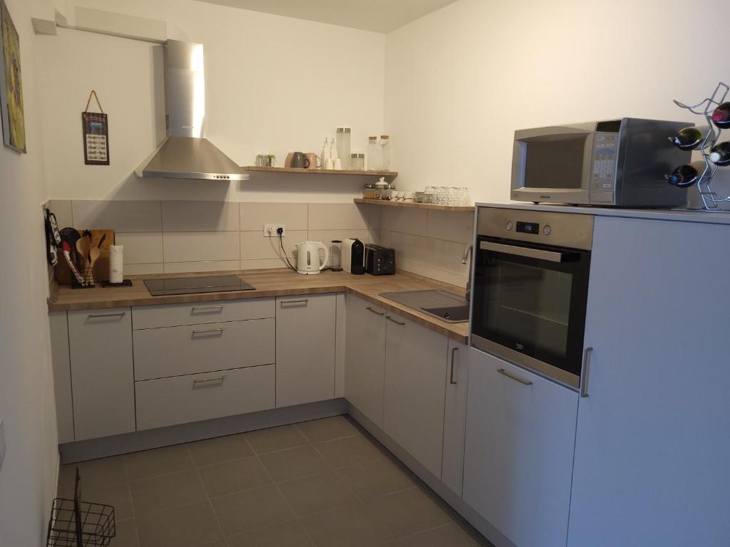 Kuchyň nebo kuchyňský kout v ubytování Apartment Kiara