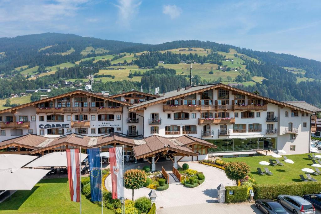 a large house with a view of the ocean at Hotel Sonne 4 Sterne Superior in Kirchberg in Tirol