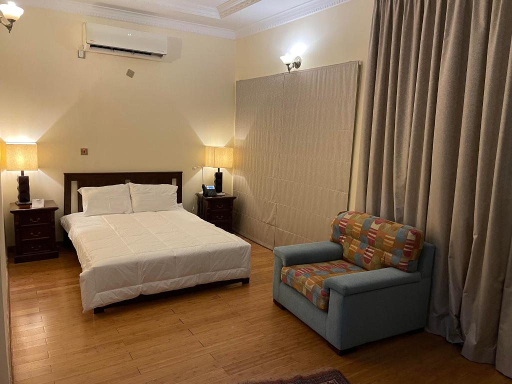 Katil atau katil-katil dalam bilik di Al Khariss Hotel