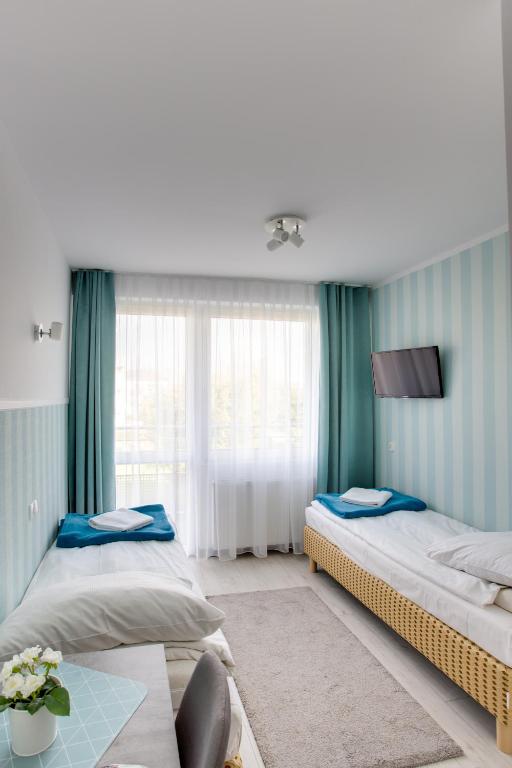 Postel nebo postele na pokoji v ubytování OWR -BESKID-