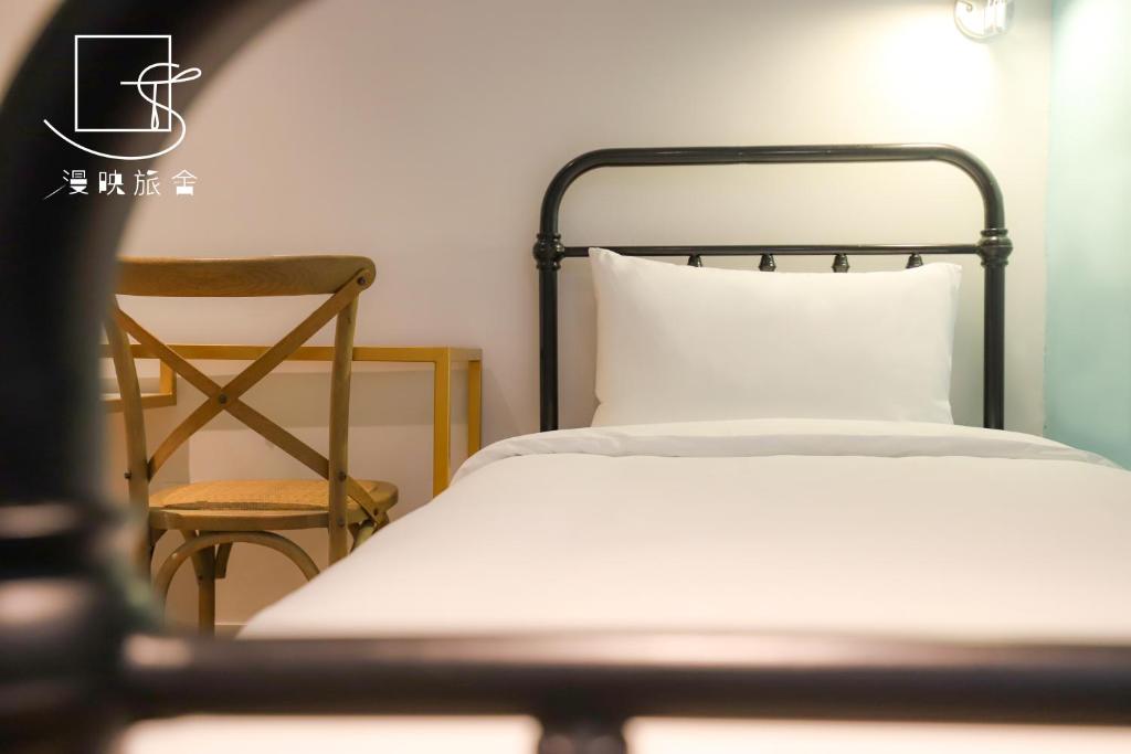 Postel nebo postele na pokoji v ubytování Slow Town Hotel-Reel