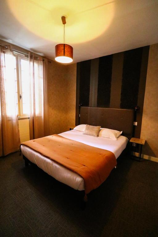 Postel nebo postele na pokoji v ubytování Hostellerie Bellevue