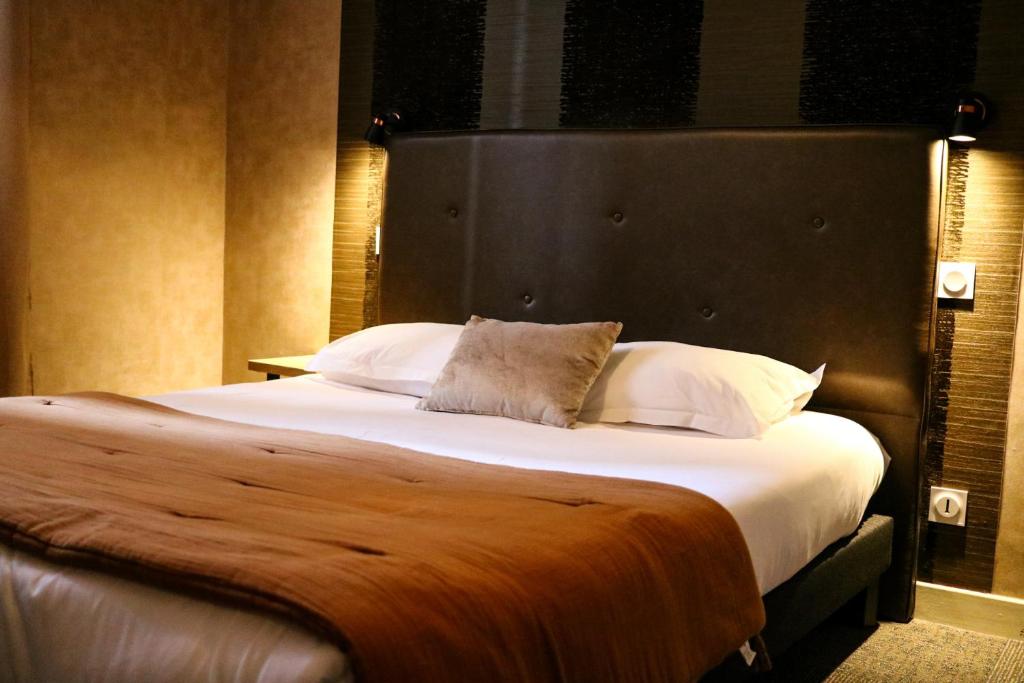 Postel nebo postele na pokoji v ubytování Hostellerie Bellevue