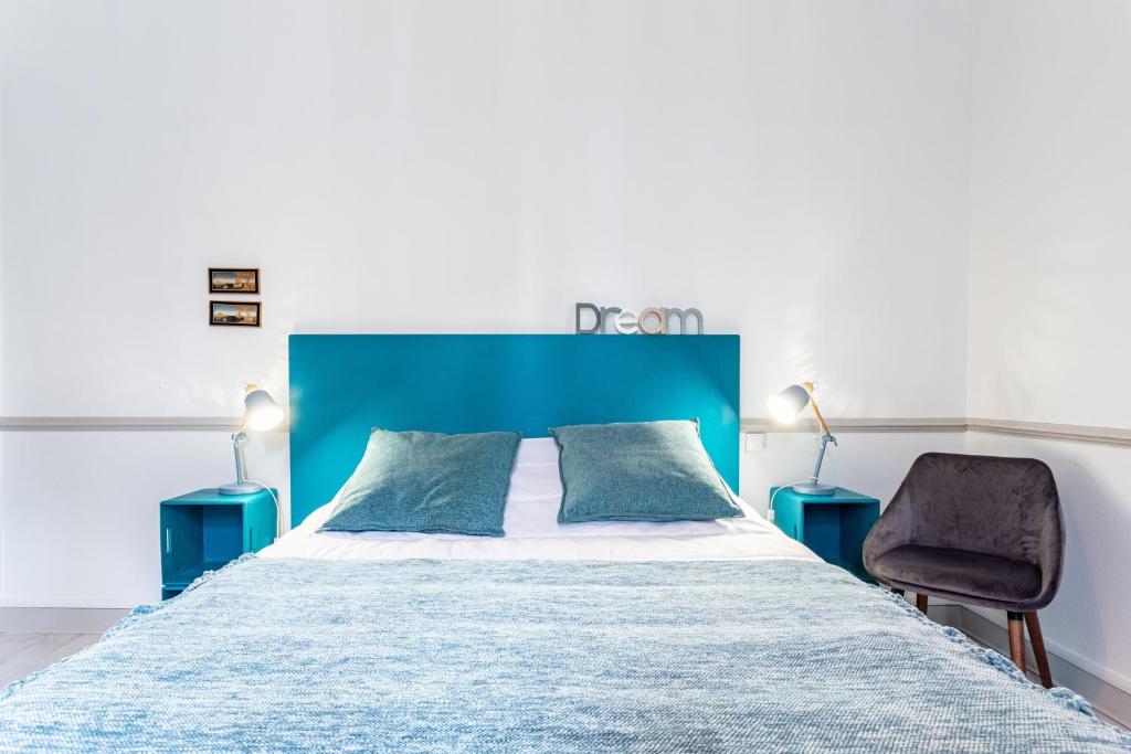 Una cama o camas en una habitaci&oacute;n de Ker Cobi