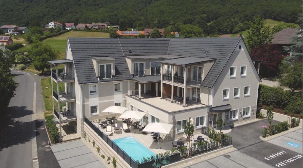 an aerial view of a large house with a pool at Landhaus Bad Gleichenberg in Bad Gleichenberg