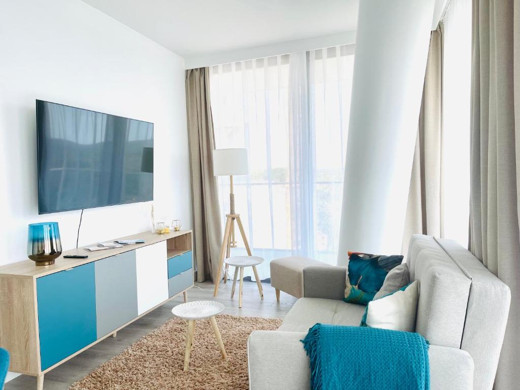 TV a/nebo společenská místnost v ubytování Wave by Baltic Home