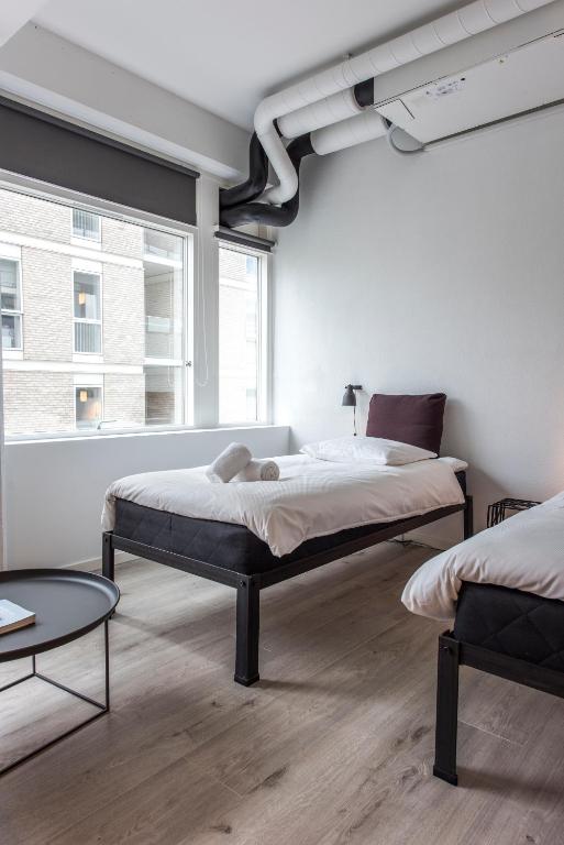 Postel nebo postele na pokoji v ubytování CPH Studio Hotel