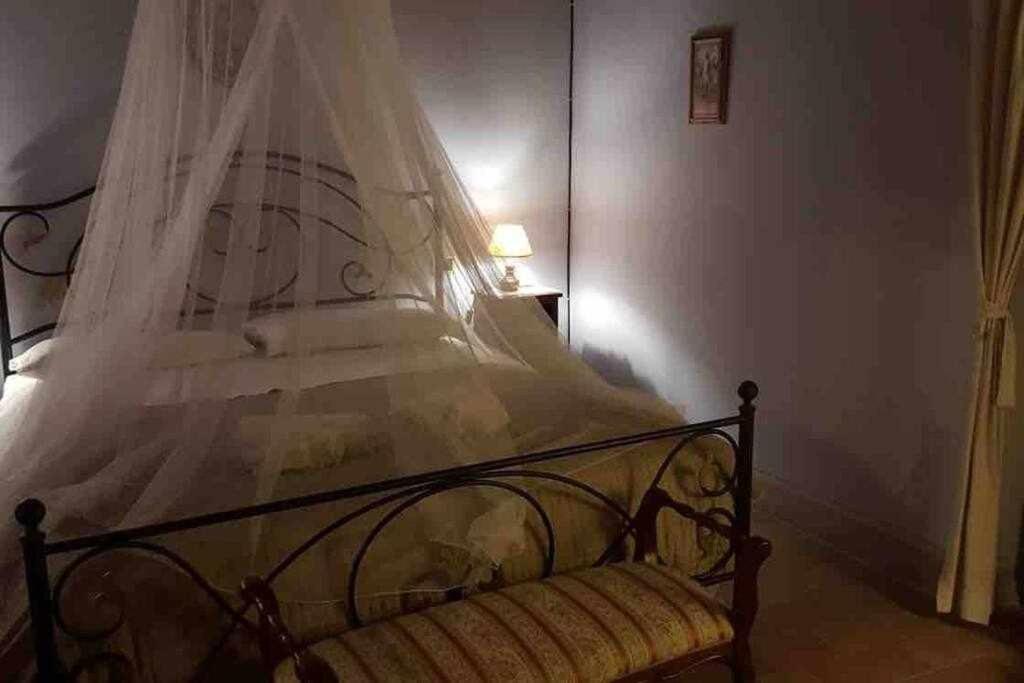 Postel nebo postele na pokoji v ubytování Il Borghetto di Pedana