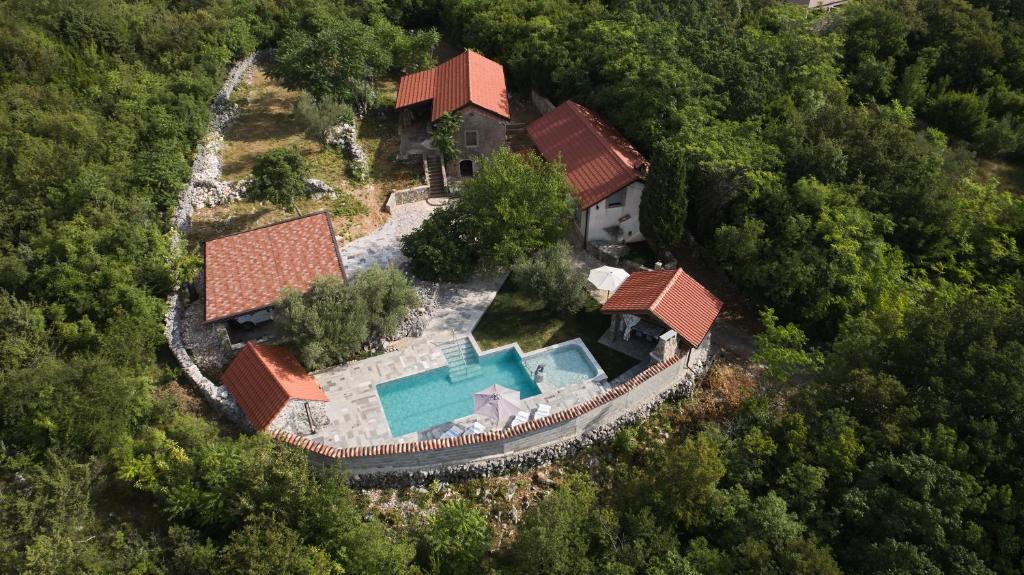 an overhead view of a house with a swimming pool at Villa Neval in Gostinjac