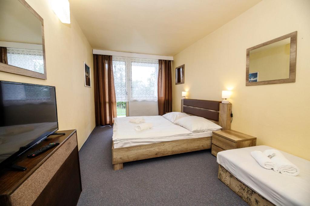 Postel nebo postele na pokoji v ubytování Panorama Orlík