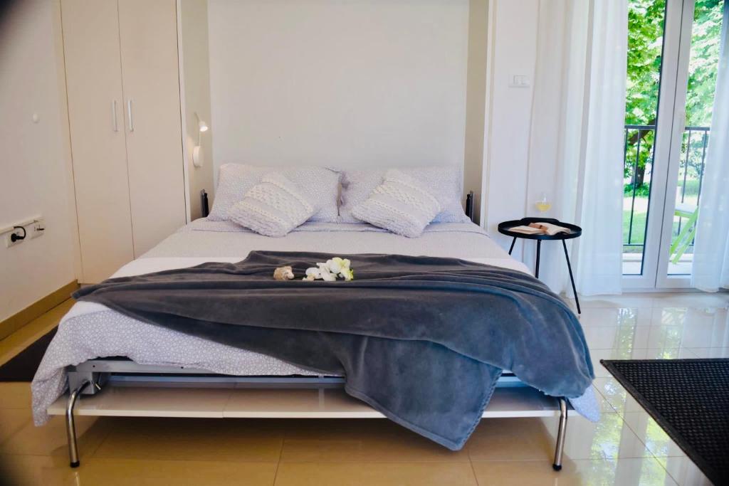Postel nebo postele na pokoji v ubytování Studio apartment Stazion with free parking