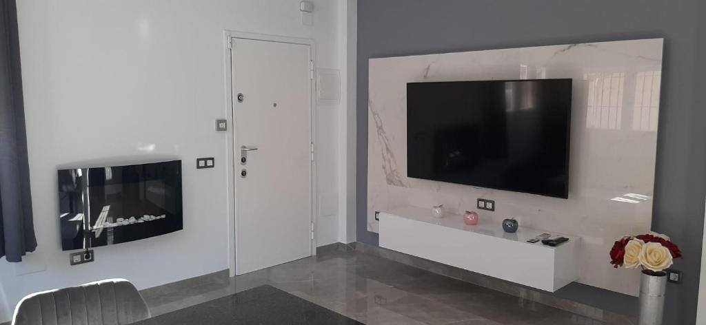 Televízia a/alebo spoločenská miestnosť v ubytovaní APARTAMENTO CENTRICO