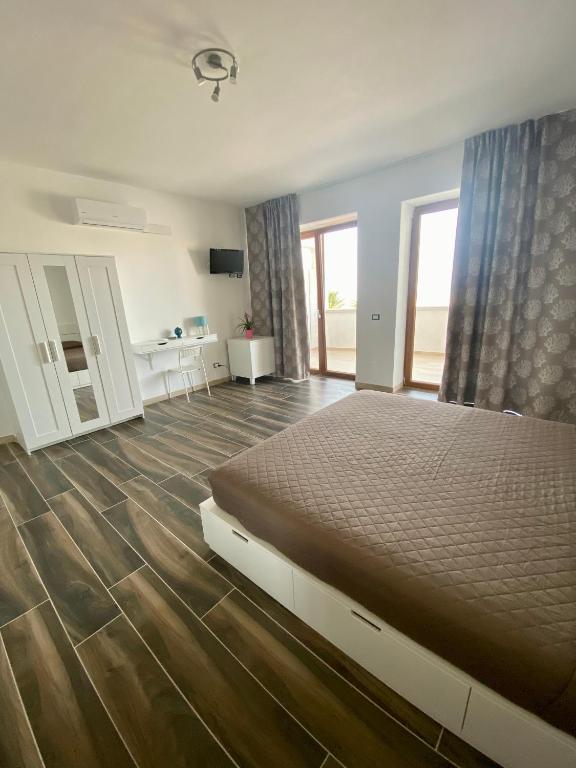 Postel nebo postele na pokoji v ubytování Manfredi Sea Room