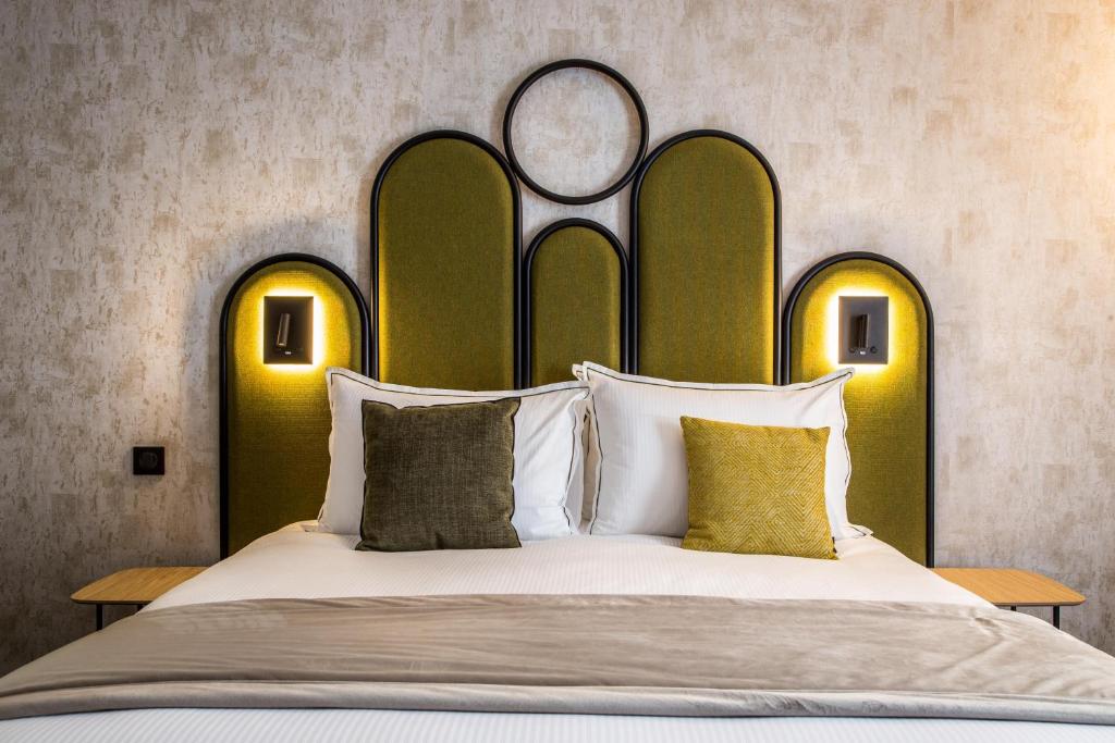 Postel nebo postele na pokoji v ubytování Best Western Le Relais du Vigneron