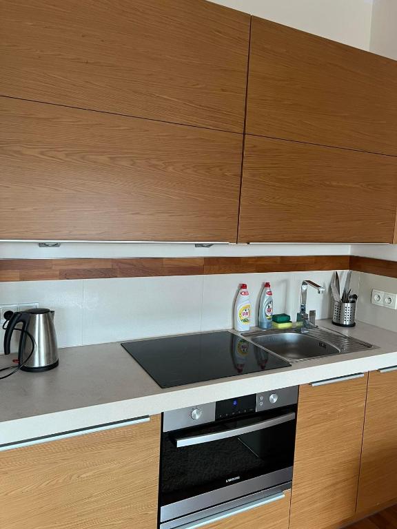 Kuchyňa alebo kuchynka v ubytovaní Neptun Park Apartament - 100 m od plaży