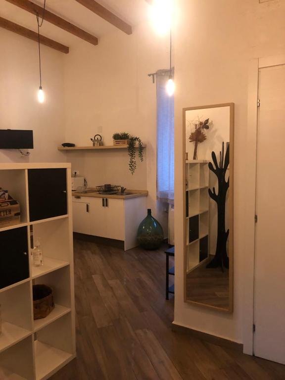 a living room with a large mirror in a room at Casa Vittoria in Salerno