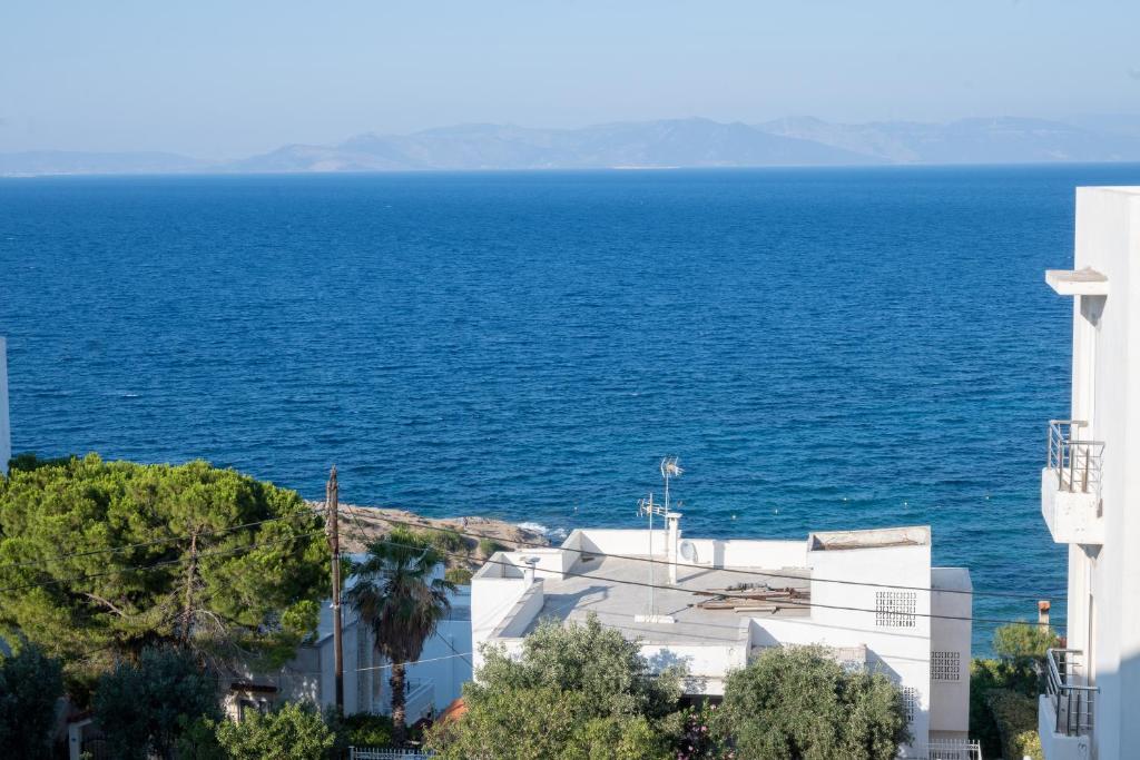 a view of the ocean from a building at Amazing Sea View, Rafina Port, Athens Airport, Self-Check-in in Rafina