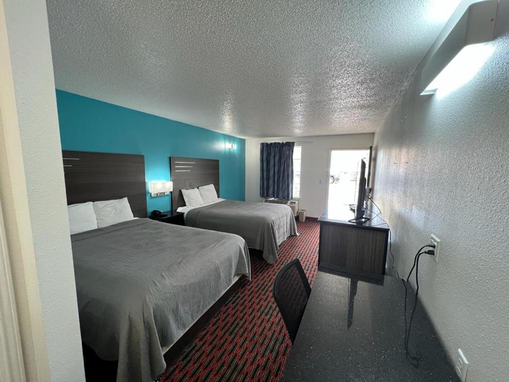 Cama ou camas em um quarto em Key West Inn - Tuscumbia