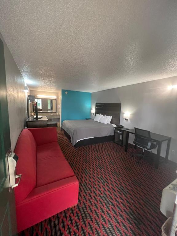Cama ou camas em um quarto em Key West Inn - Tuscumbia