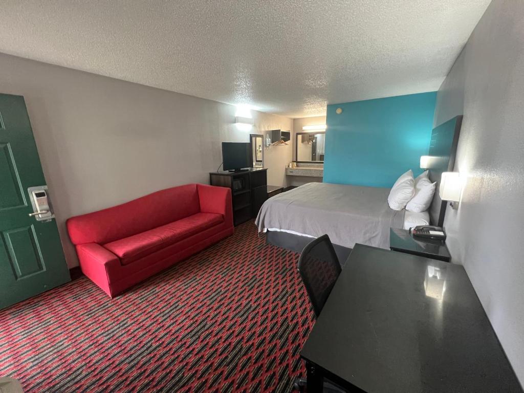 Cama ou camas em um quarto em Key West Inn - Tuscumbia