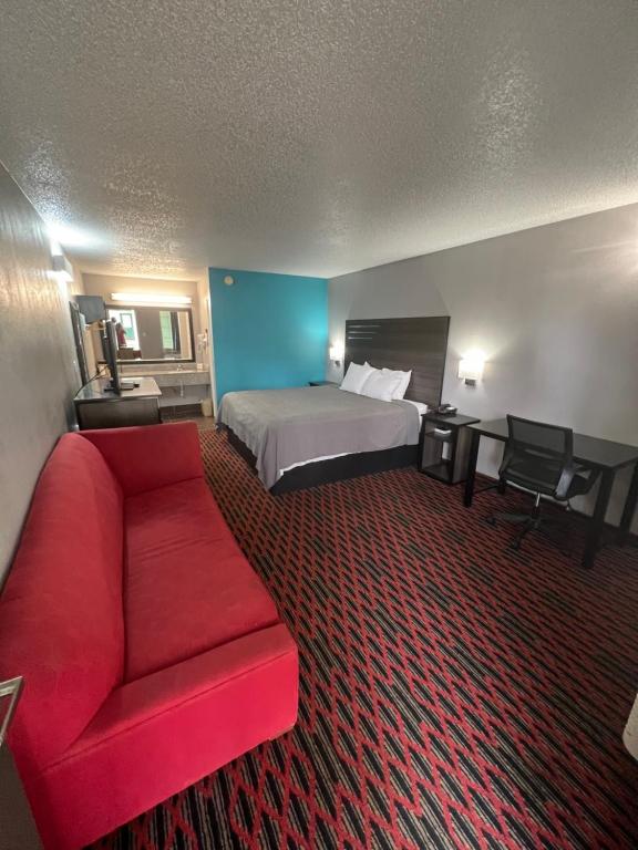 Cama ou camas em um quarto em Key West Inn - Tuscumbia