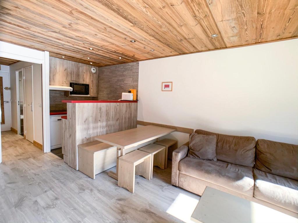 a living room with a couch and a table at Studio Tignes, 2 pièces, 4 personnes - FR-1-502-156 in Tignes