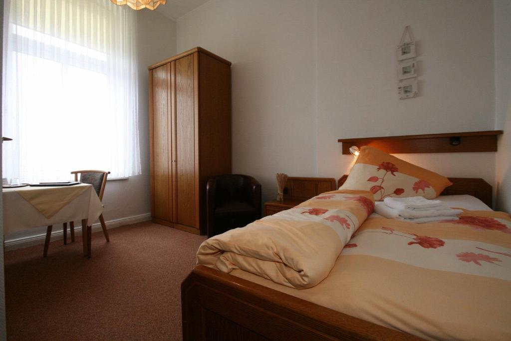 Postel nebo postele na pokoji v ubytování Hotel Rummeni