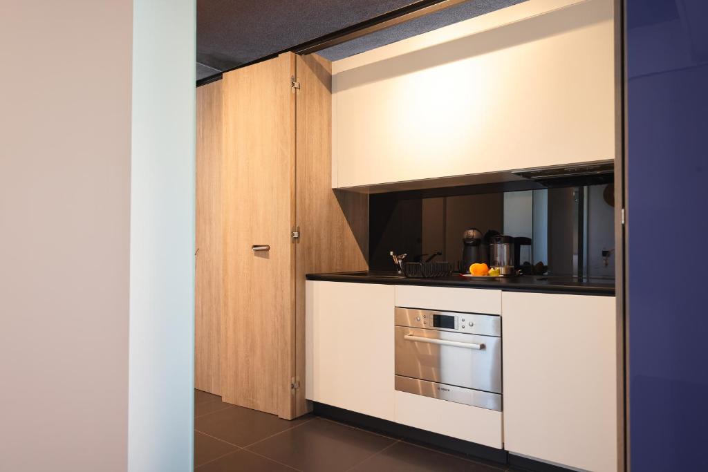 Kuchyňa alebo kuchynka v ubytovaní Apartment F