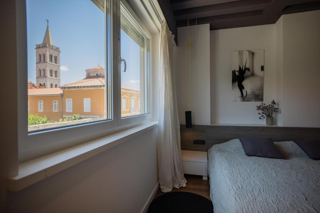 Posteľ alebo postele v izbe v ubytovaní Apartment F
