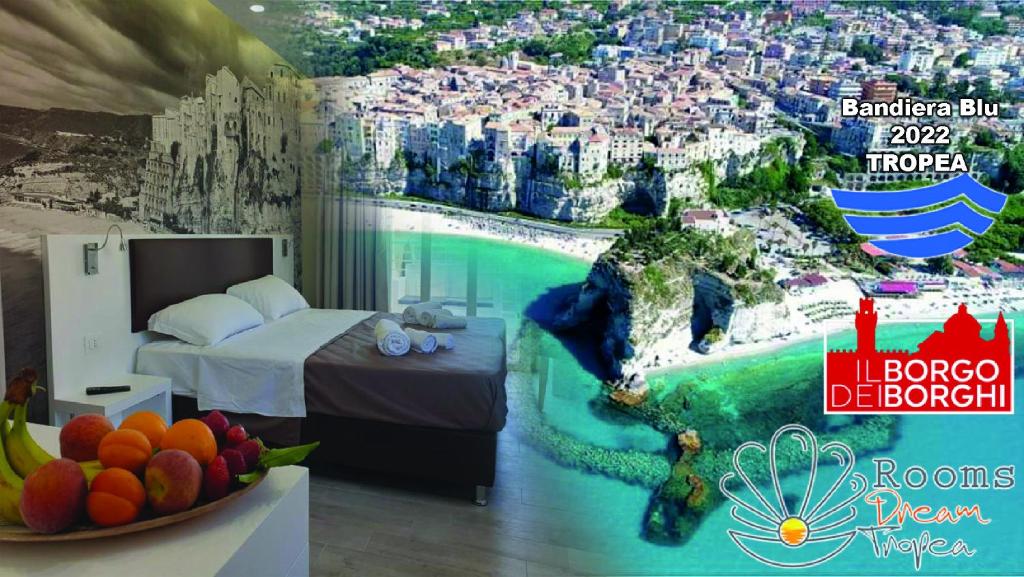 a hotel room with a mural of a city at Rooms Dream Tropea in Tropea