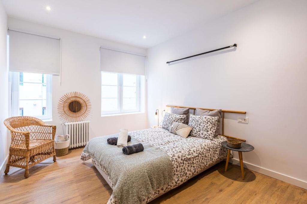 A bed or beds in a room at Lujo, comodidad y espacio Gijon centro
