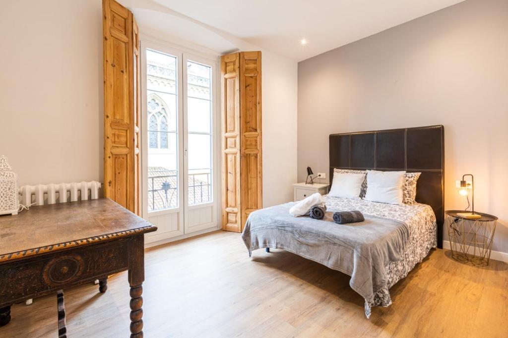 A bed or beds in a room at Lujo, comodidad y espacio Gijon centro