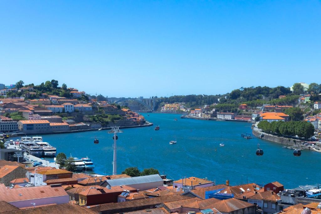 a view of a harbor with boats in the water at 180º Porto River View in Vila Nova de Gaia