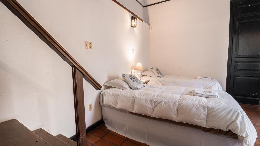 Postel nebo postele na pokoji v ubytování Posada de la Flor