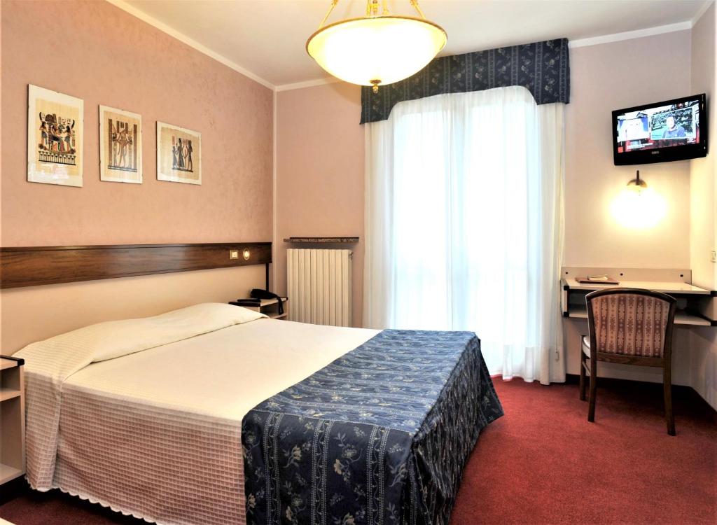 Postel nebo postele na pokoji v ubytování Bes Hotel Papa San Pellegrino Terme
