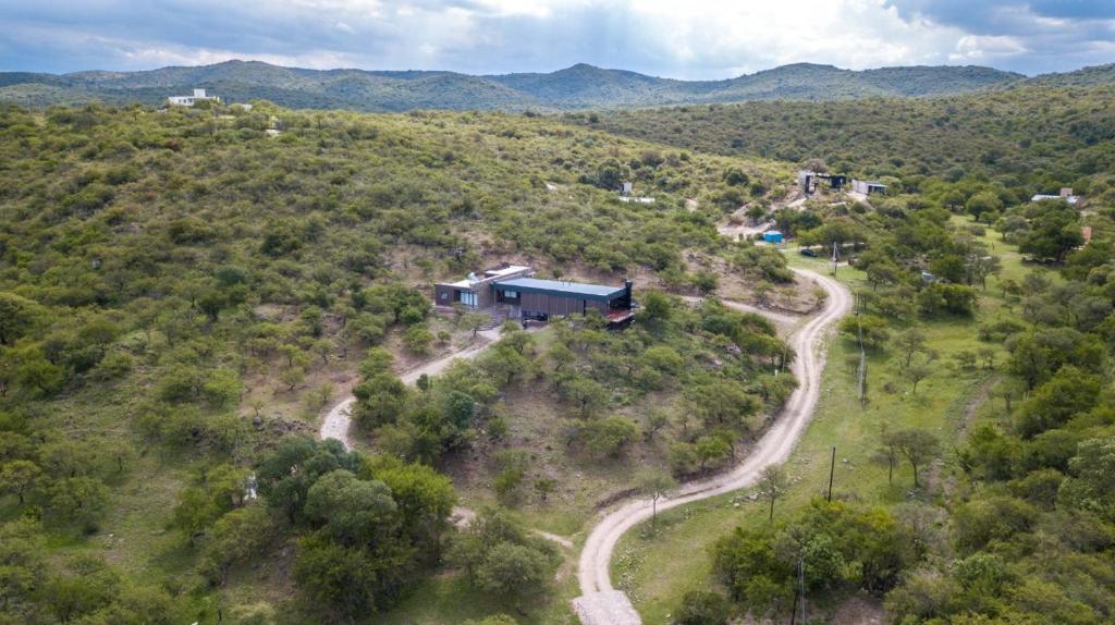 an aerial view of a house on a hill with a road at Casa de campo in Villa San Nicolás