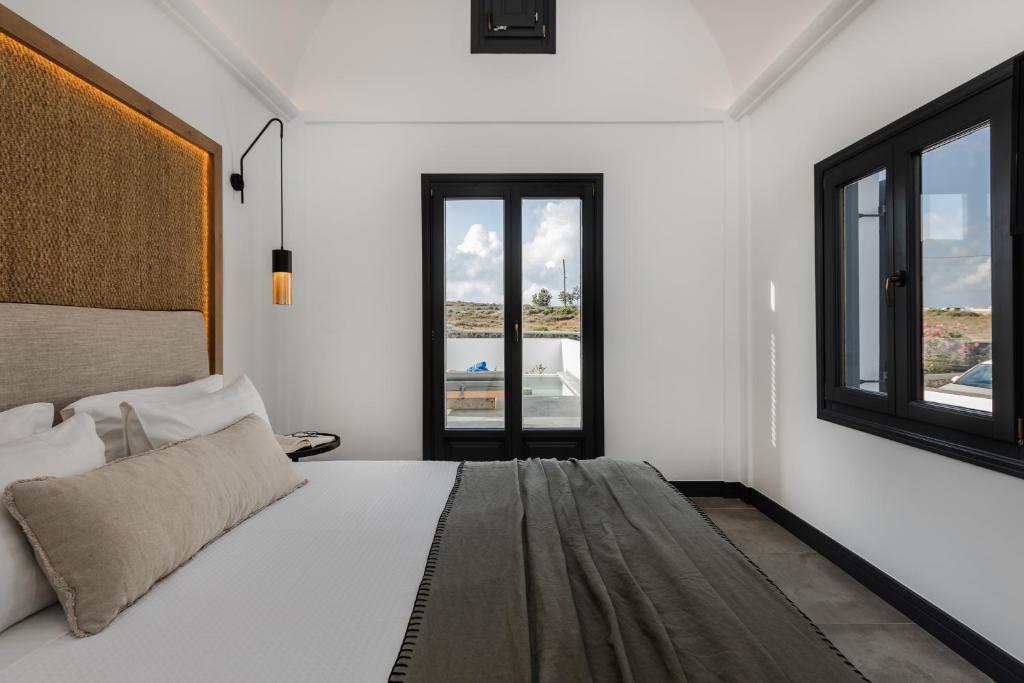 Postel nebo postele na pokoji v ubytování Vineyard Exclusive Suites