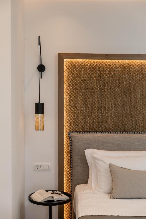 Postel nebo postele na pokoji v ubytování Vineyard Exclusive Suites