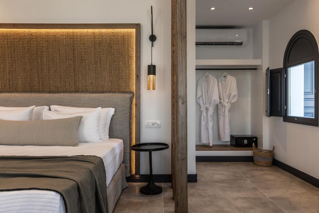 Postel nebo postele na pokoji v ubytování Vineyard Exclusive Suites