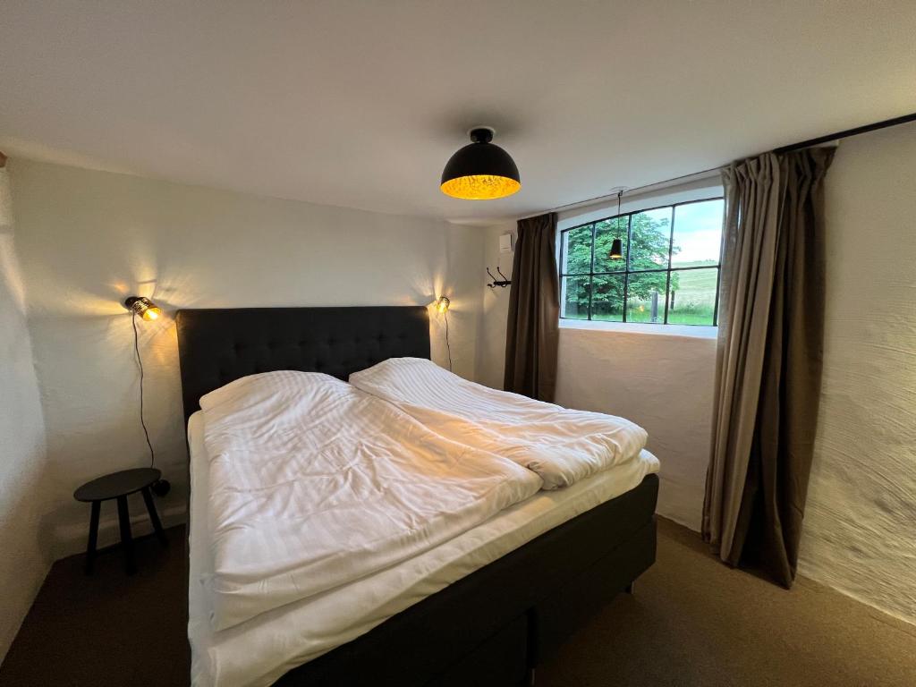 Postel nebo postele na pokoji v ubytování Backadal Gård BnB
