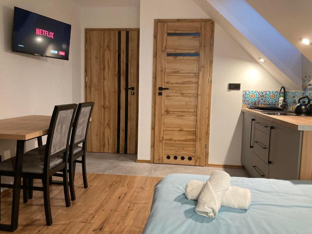 Łóżko lub łóżka w pokoju w obiekcie Rezydencja pod Cergową Wellness & SPA